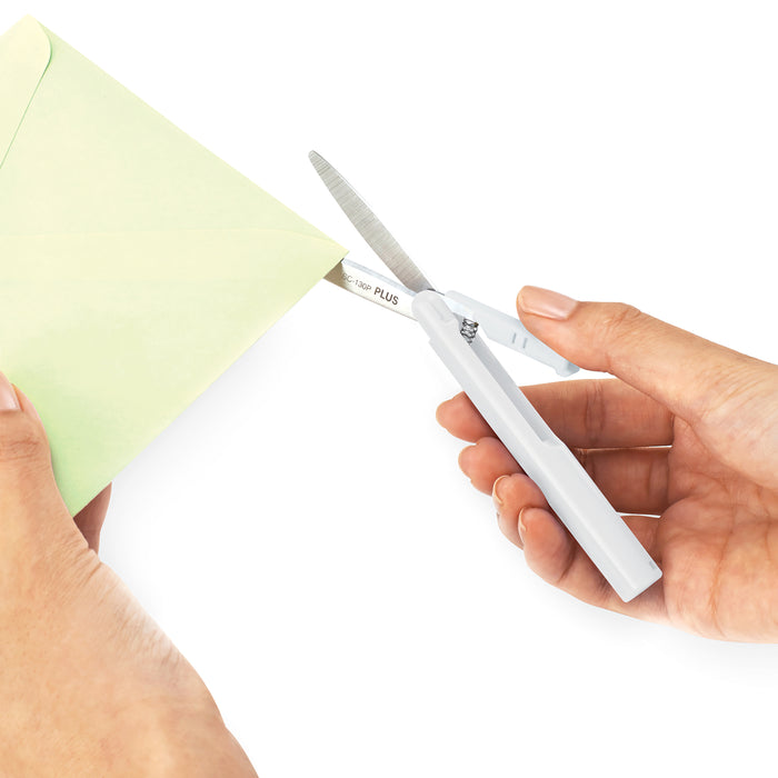 Twiggy curved blade scissors in white cutting paper