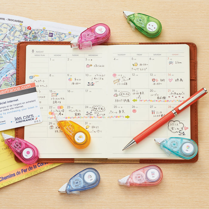 PLUS Petit Deco Tape applying design to planner page