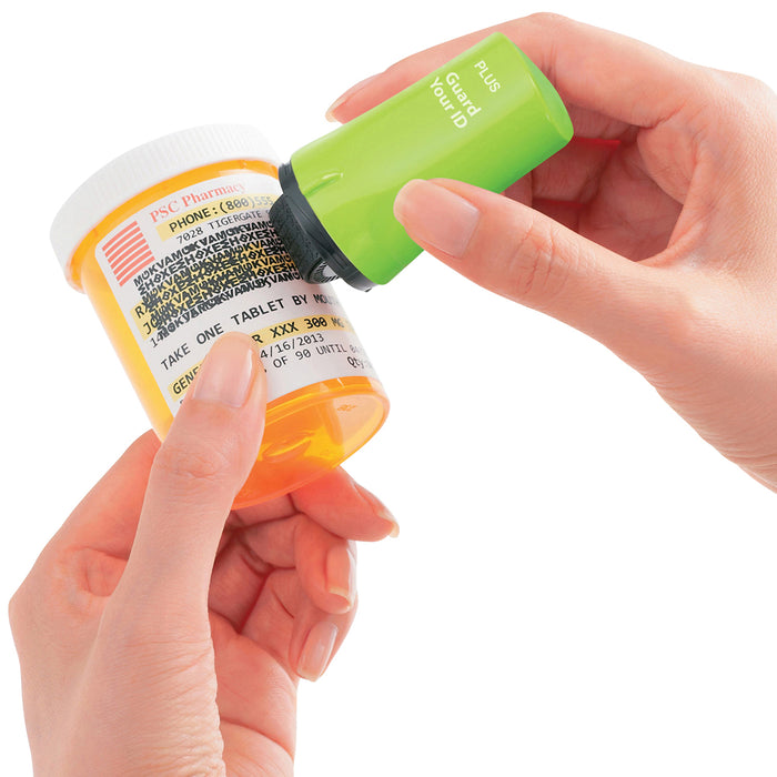 A green Guard Your ID roller security kit with an extra wide roller, along with its cap and ink pattern.