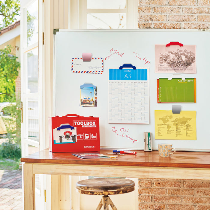 PLUS large extra strong rubber-coated magnet on whiteboard holding papers