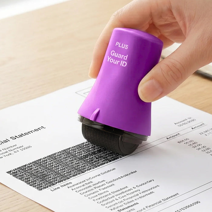 A hand rolls a Guard Your ID Advanced Roller across a statement, masking the account details with a patented letter pattern